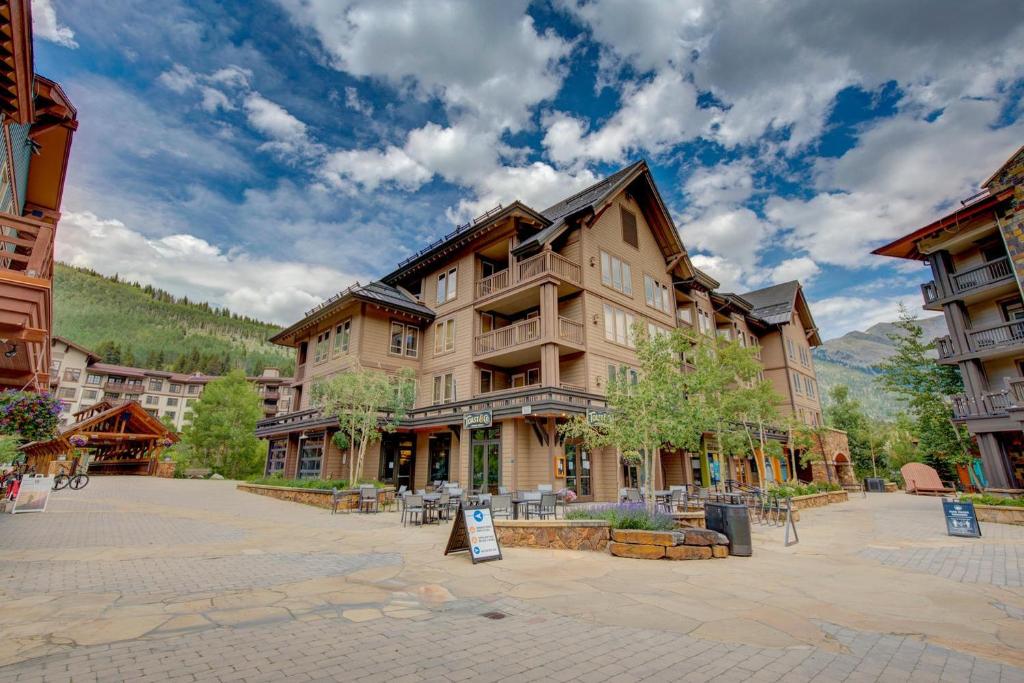 a large building in the middle of a courtyard at Taylor's Crossing #210 condo in Copper Mountain