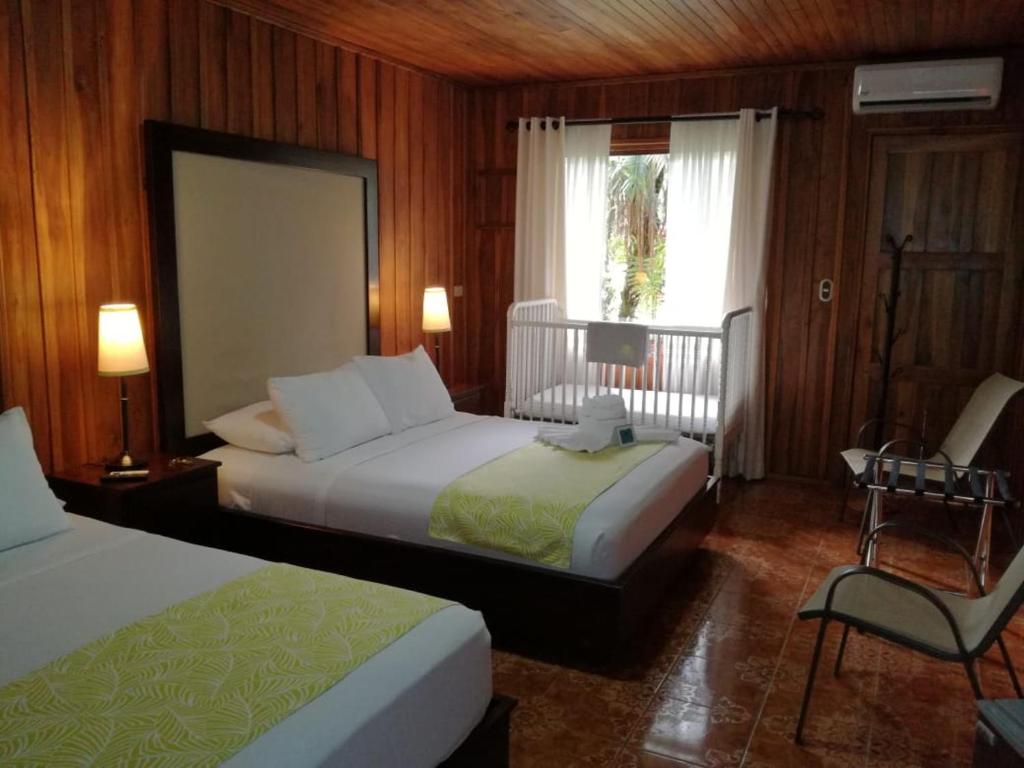Postel nebo postele na pokoji v ubytování Casona Rústica & Bungalow