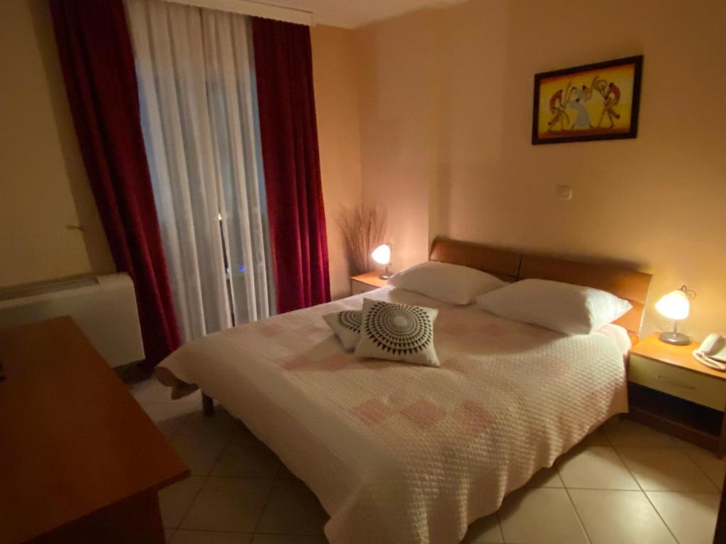 Postel nebo postele na pokoji v ubytování Hotel Aurora