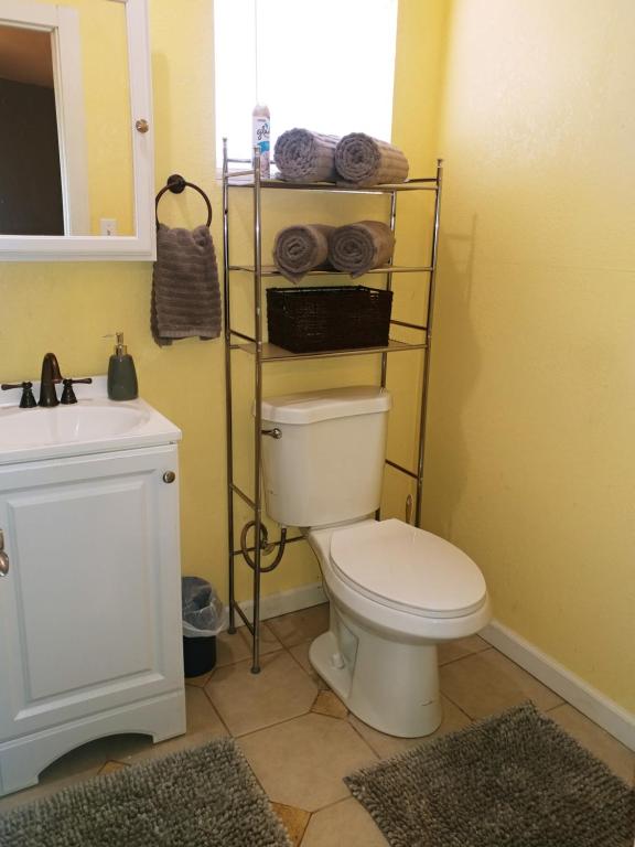 a bathroom with a white toilet and a sink at Dolan Springs, Grand Canyon Skywalk in Dolan Springs