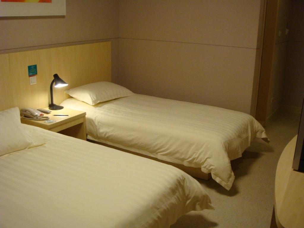 Postel nebo postele na pokoji v ubytování Jinjiang Inn - Shanghai Changning