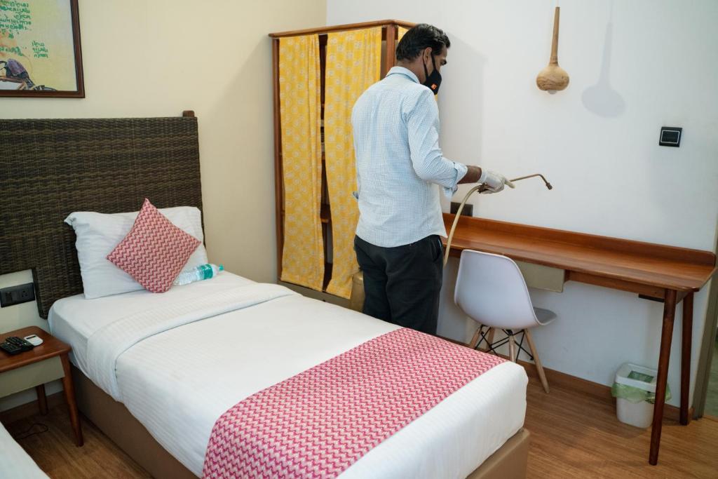 Postel nebo postele na pokoji v ubytování Hotel Beebiz Guindy