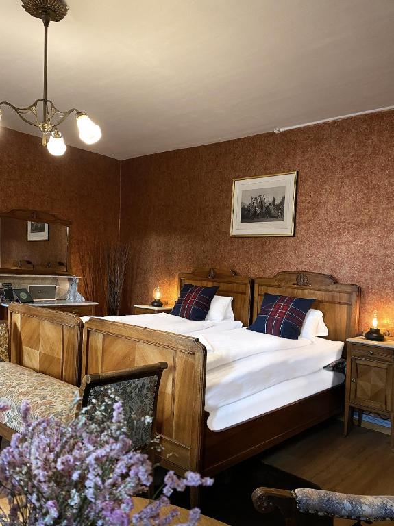 Postel nebo postele na pokoji v ubytování DU GLACIER Boutique & Traditions Hotel