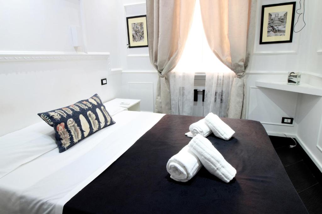 A bed or beds in a room at L'antica Locanda Dell'Orso