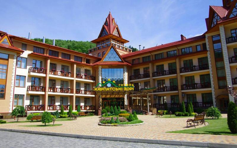 a large building with a tower on top of it at Карпатські зорі SPAhotel in Yaremche