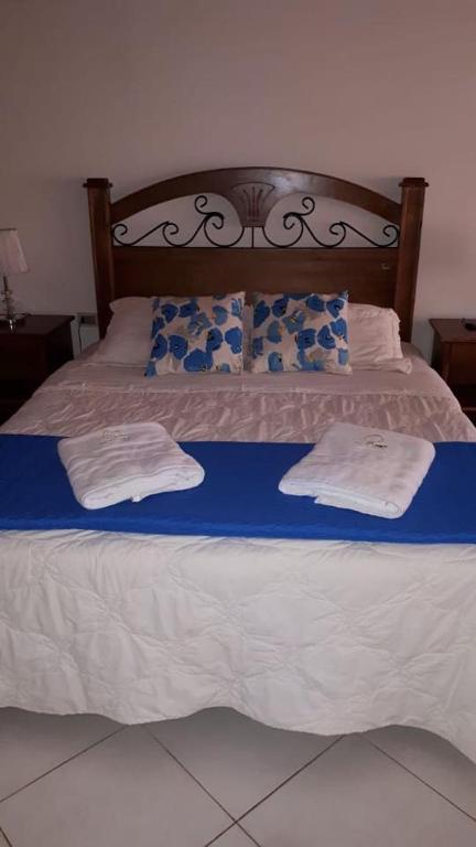 Postel nebo postele na pokoji v ubytování Sol de Luque Casa-hotel