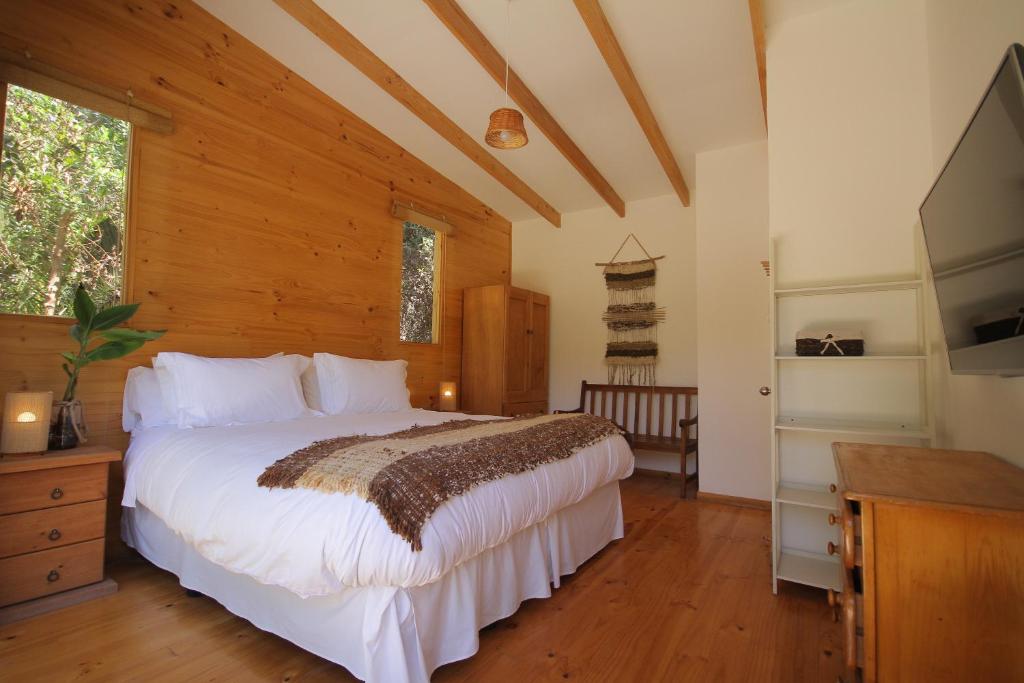 Postel nebo postele na pokoji v ubytování El Arbol Eco Lodge
