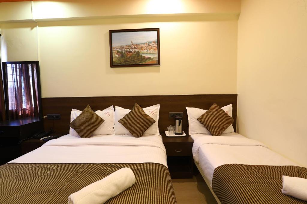 Postel nebo postele na pokoji v ubytování Hotel Sona