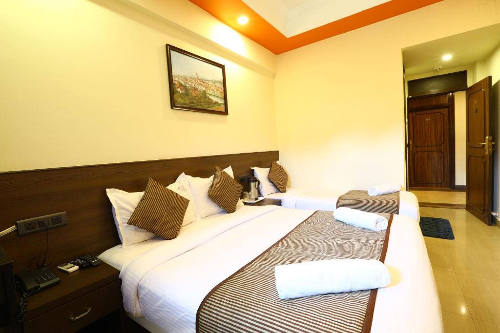 Postel nebo postele na pokoji v ubytování Hotel Sona