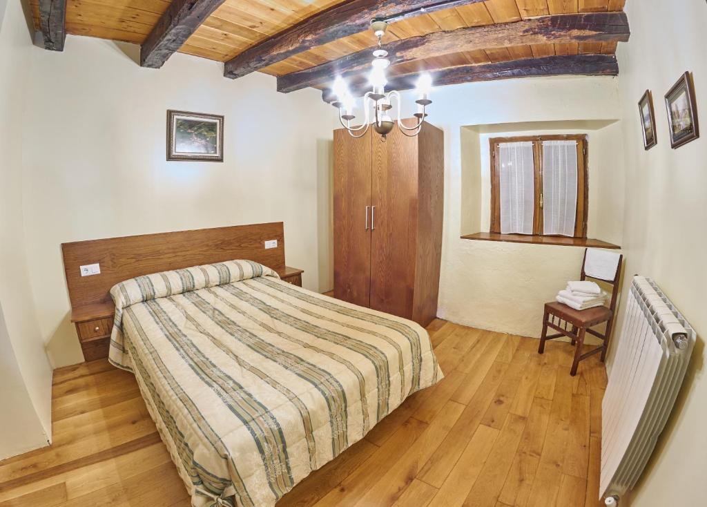 Postel nebo postele na pokoji v ubytování Casa Rural Lenco