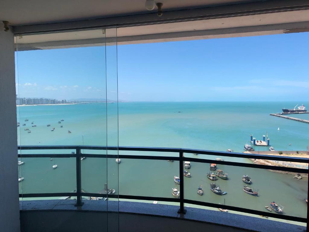 a view of the ocean from a balcony at Flat Vista Completa Beira Mar in Fortaleza