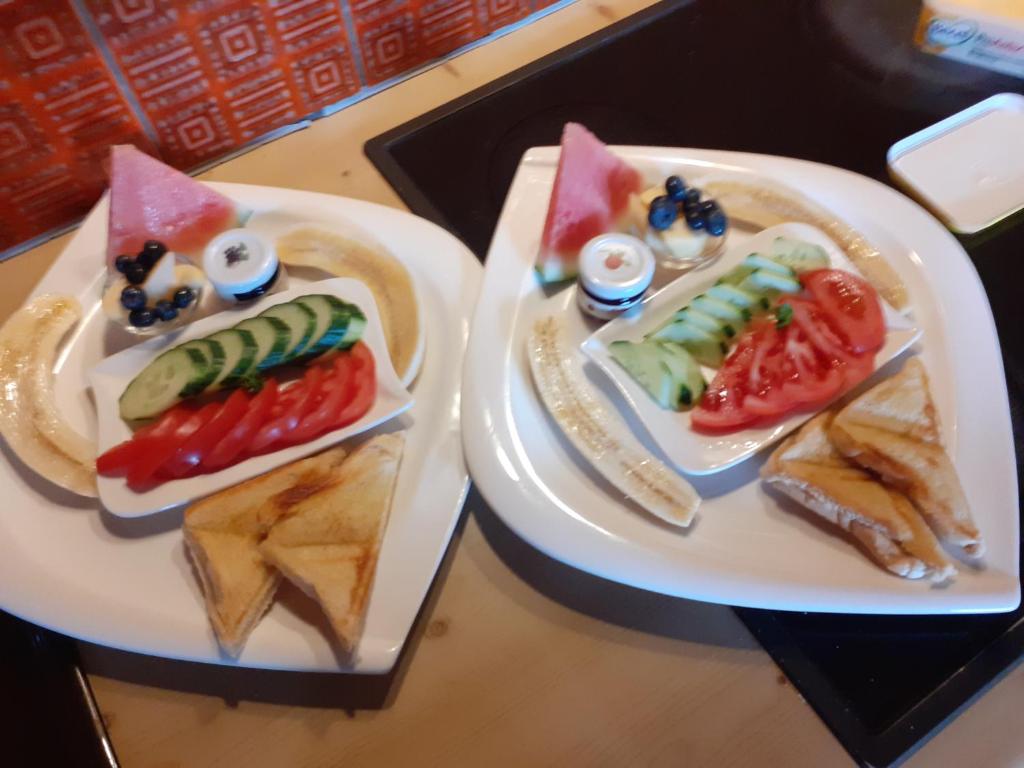 two plates of food with sandwiches on a table at Sonne in Halblech