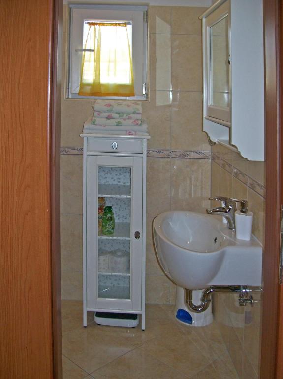 Koupelna v ubytování Apartments Grbin