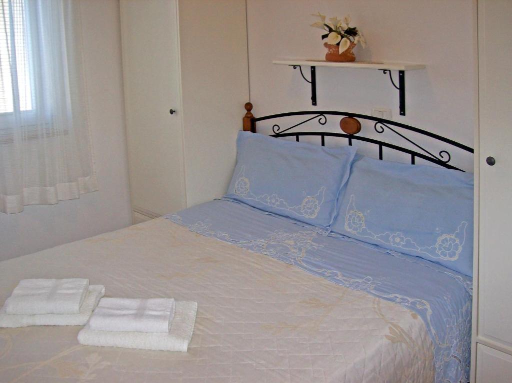 Postel nebo postele na pokoji v ubytování Apartments Grbin