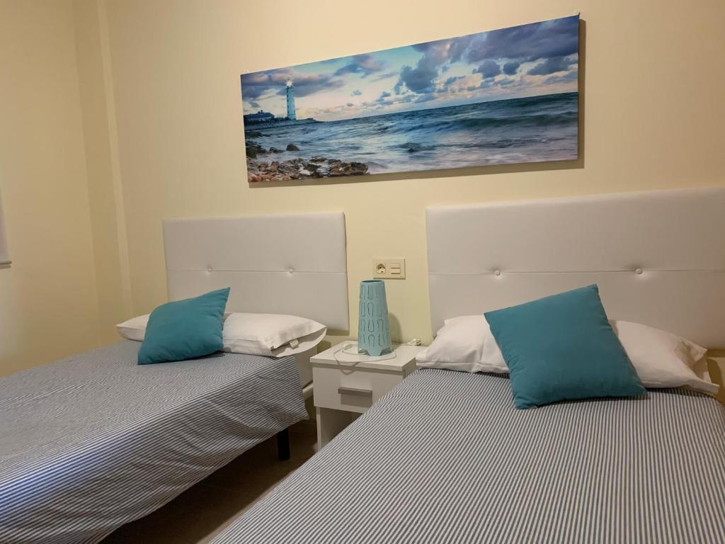 A bed or beds in a room at Maria Perla Medano