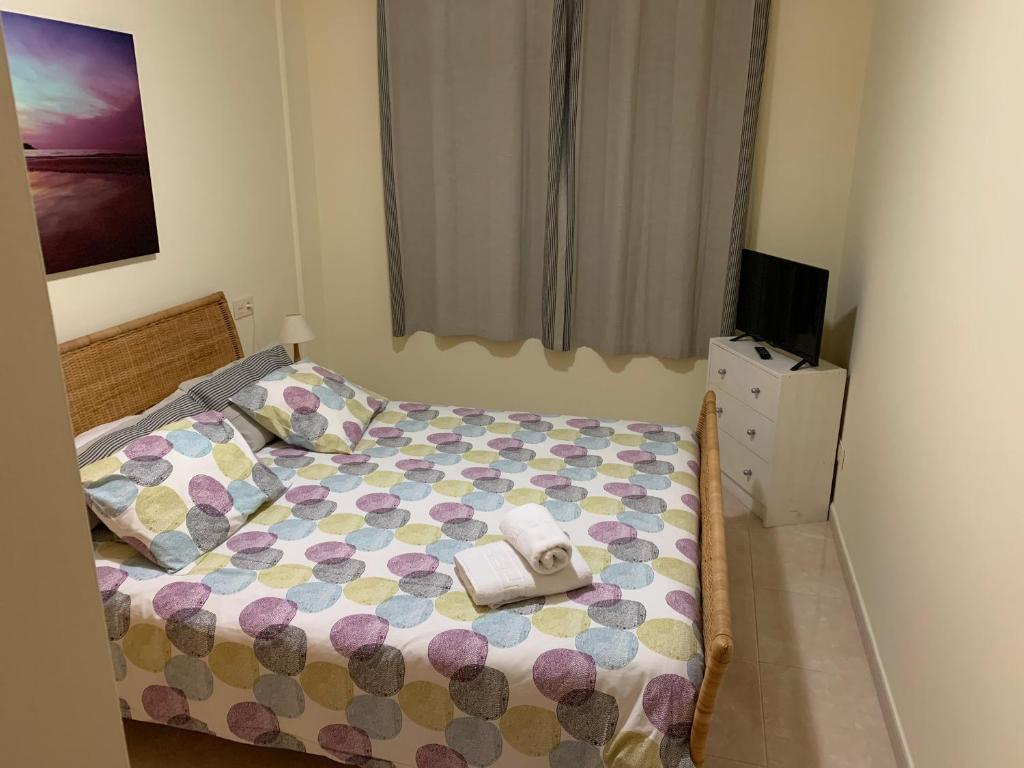 A bed or beds in a room at Maria Perla Medano