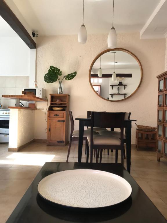 a dining room with a table and a mirror at Córdoba Rent Apart in Córdoba