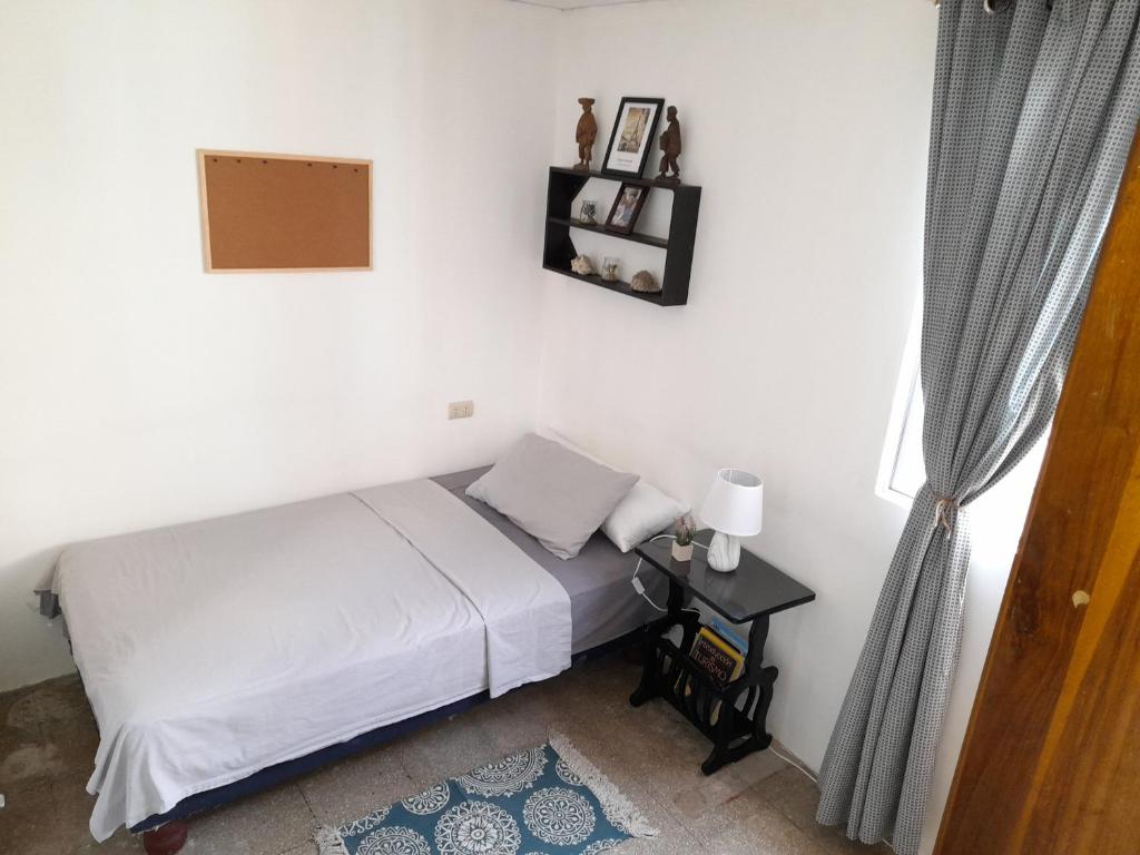 Postel nebo postele na pokoji v ubytování Casa IWANA