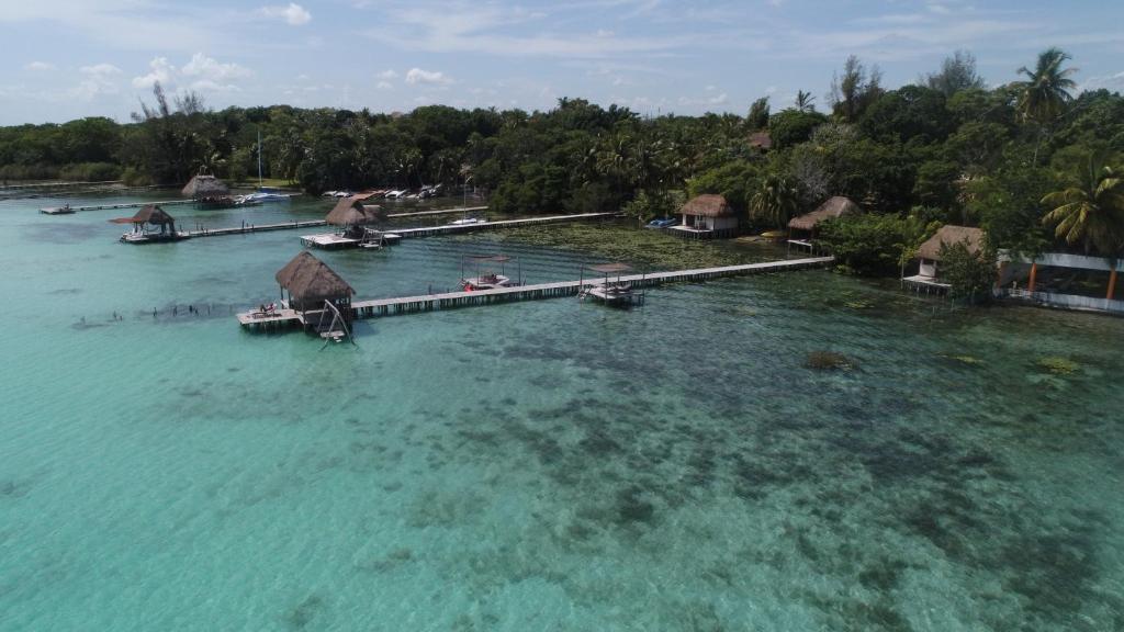 an aerial view of a resort in the water at LAGOON SPECIAL Suite: Bikes & Kayaks! in Bacalar
