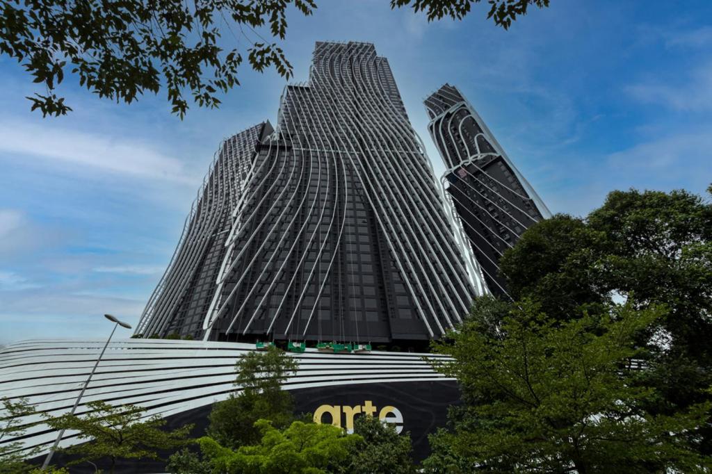 uma vista de dois edifícios altos com árvores na frente em Zetter Suite Arte Mont Kiara em Kuala Lumpur