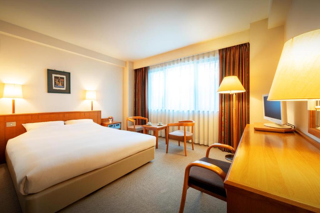 Postel nebo postele na pokoji v ubytování Hotel Io Alpheratz
