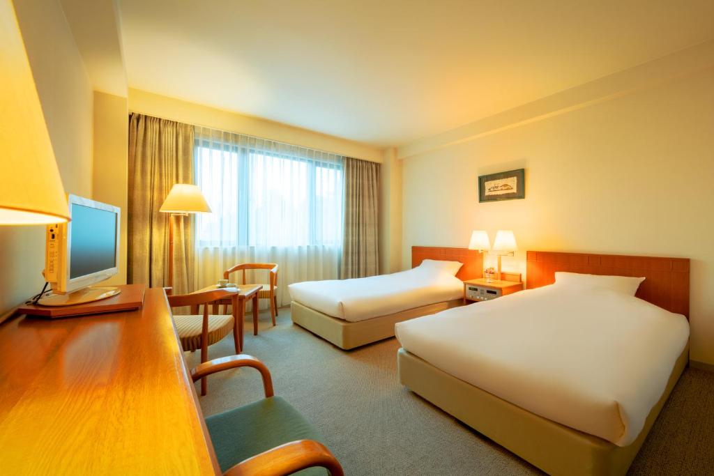 Postel nebo postele na pokoji v ubytování Hotel Io Alpheratz