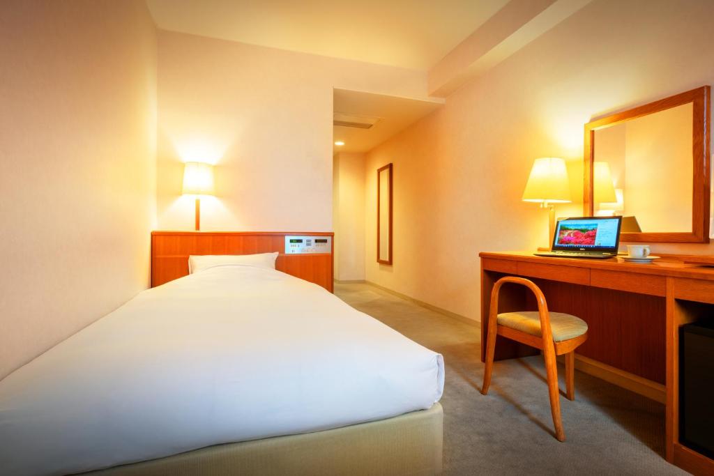 Postel nebo postele na pokoji v ubytování Hotel Io Alpheratz