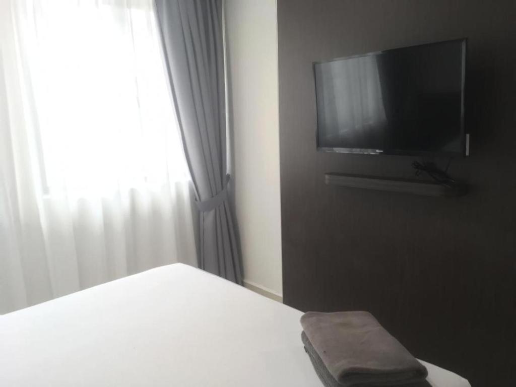 TV a/nebo společenská místnost v ubytování Desaru, Bayu Balau Beach Resort