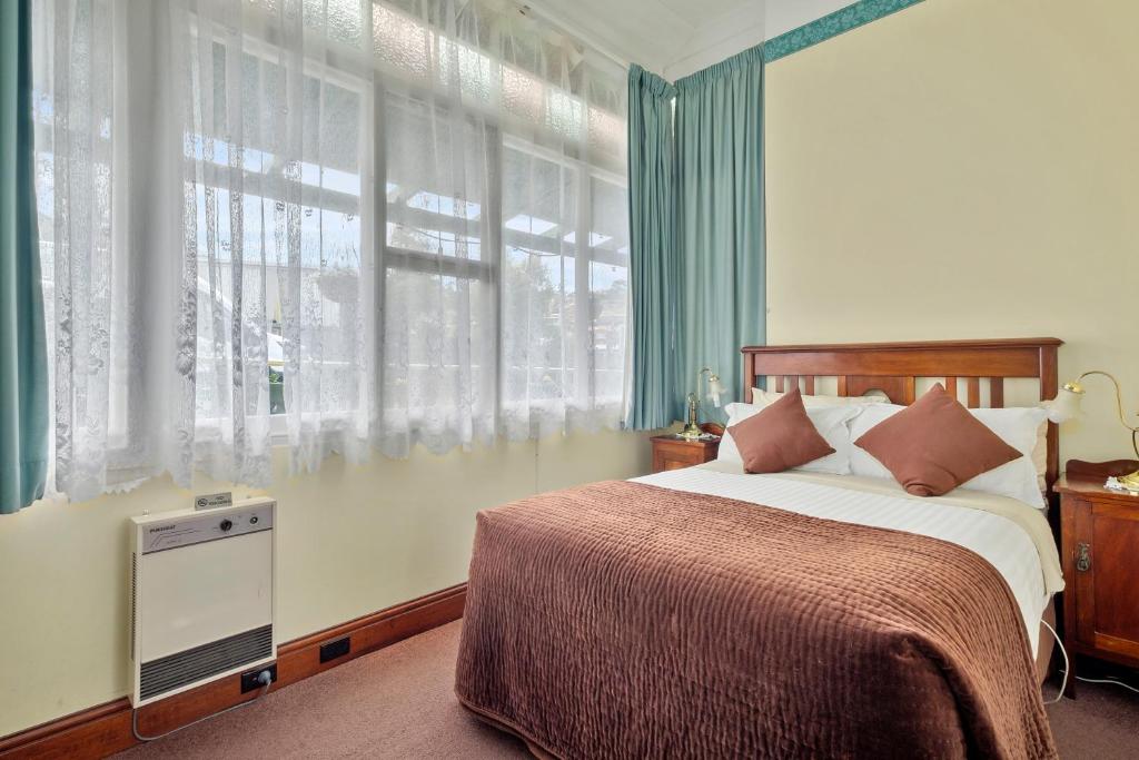 Postel nebo postele na pokoji v ubytování Orana House