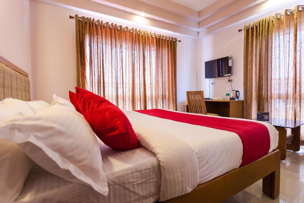 Postel nebo postele na pokoji v ubytování Hotel Garden Inn