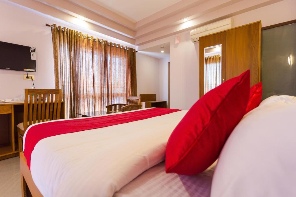 Postel nebo postele na pokoji v ubytování Hotel Garden Inn