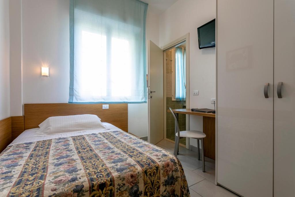 Postel nebo postele na pokoji v ubytování Hotel Baya - in centro, sul mare
