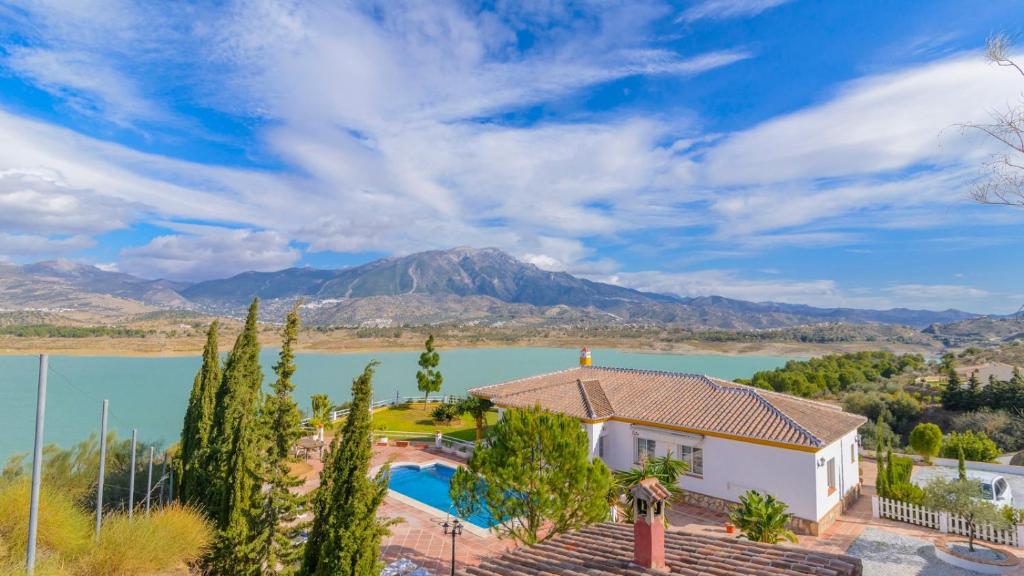 an image of a house with a mountain in the background at Casa Rocio y Paloma Vinuela by Ruralidays in Viñuela