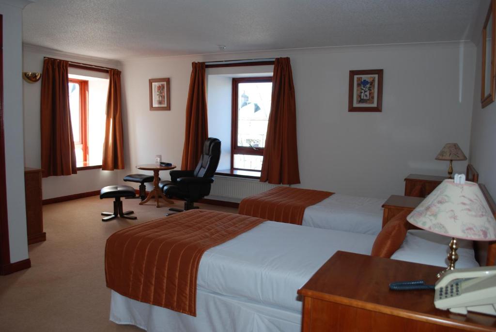 Postel nebo postele na pokoji v ubytování The Priory Hotel