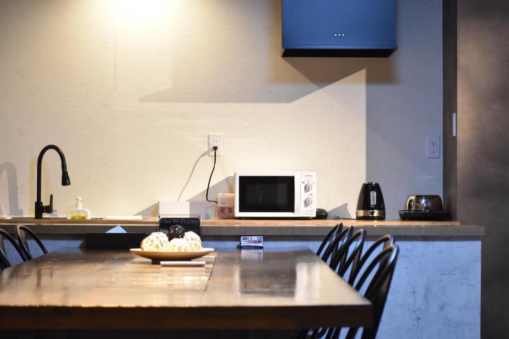 Kuchyň nebo kuchyňský kout v ubytování Shinsaibashi House
