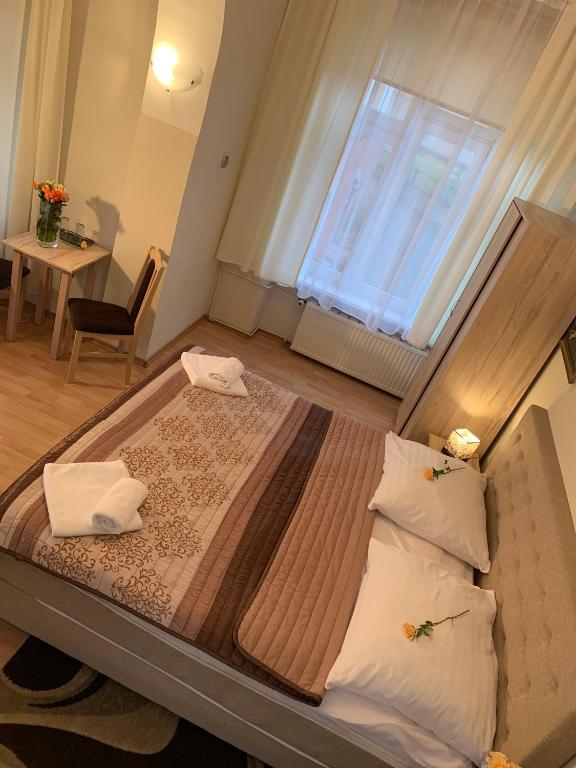 Postel nebo postele na pokoji v ubytování OW Meduza i Biala Mewa