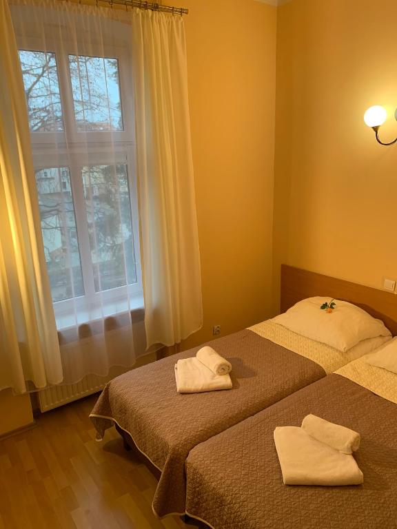 Postel nebo postele na pokoji v ubytování OW Meduza i Biala Mewa