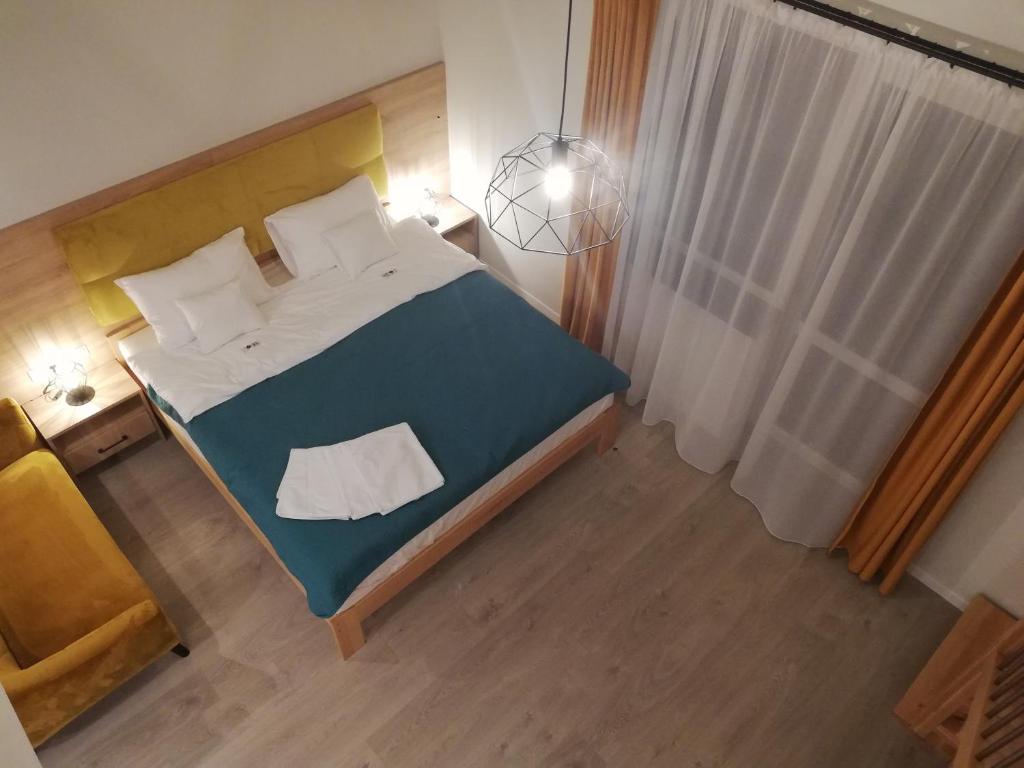 Posteľ alebo postele v izbe v ubytovaní U ŹRÓDEŁ