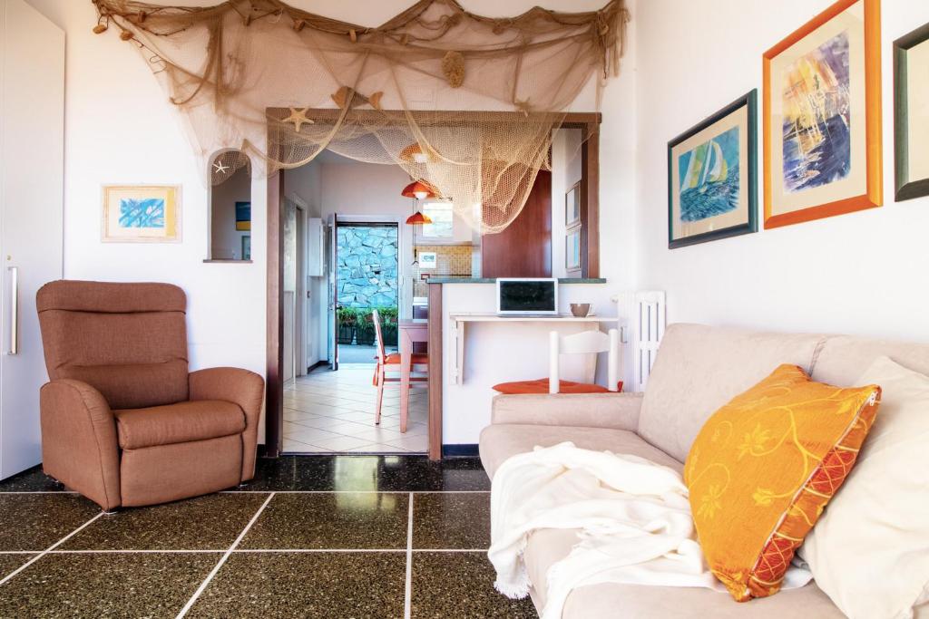 Televízia a/alebo spoločenská miestnosť v ubytovaní Appartamento Terrazza DA...Mare