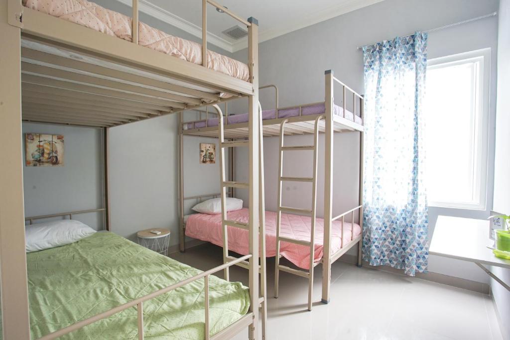 Postel nebo postele na pokoji v ubytování INNI Homestay