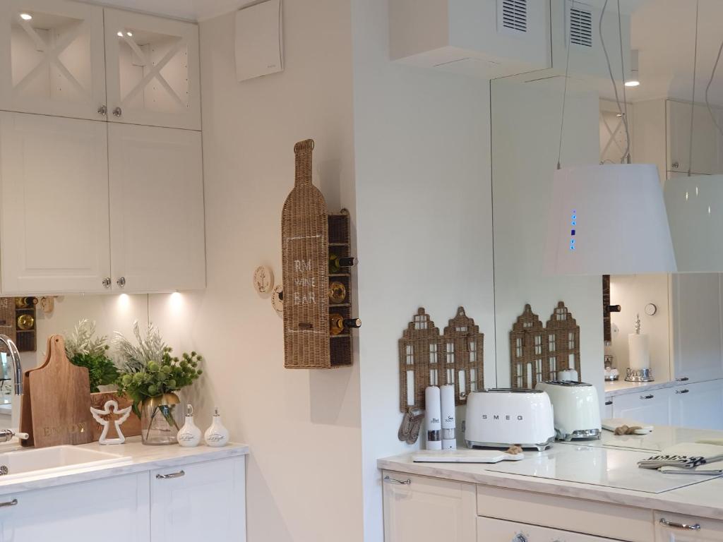 Kuchyň nebo kuchyňský kout v ubytování Apartament Prestige & Sea Balticus A4
