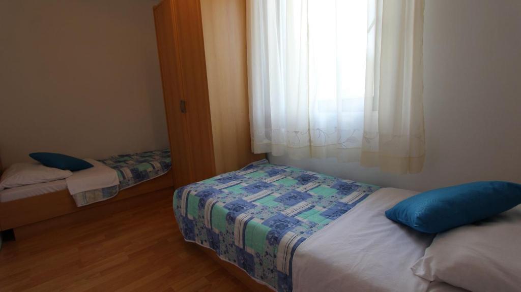 Postel nebo postele na pokoji v ubytování Apartment Turkalj