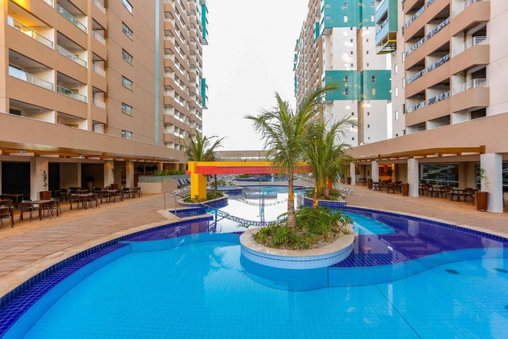 a swimming pool in the middle of a building at Olímpia Thermas Resort in Olímpia