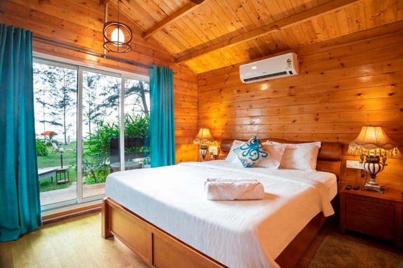 Postel nebo postele na pokoji v ubytování Montego Bay Beach Village - Morjim