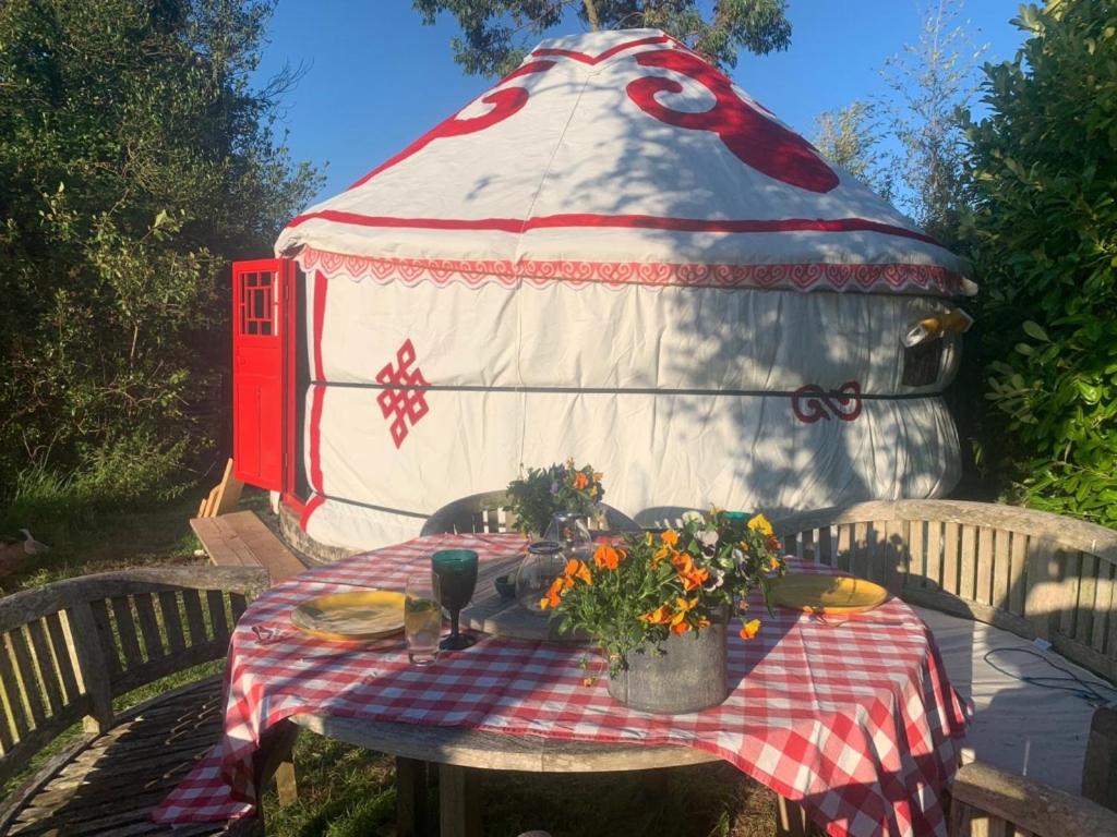 a picnic table in front of a play house at Traditional YURT @ Longleat in Warminster