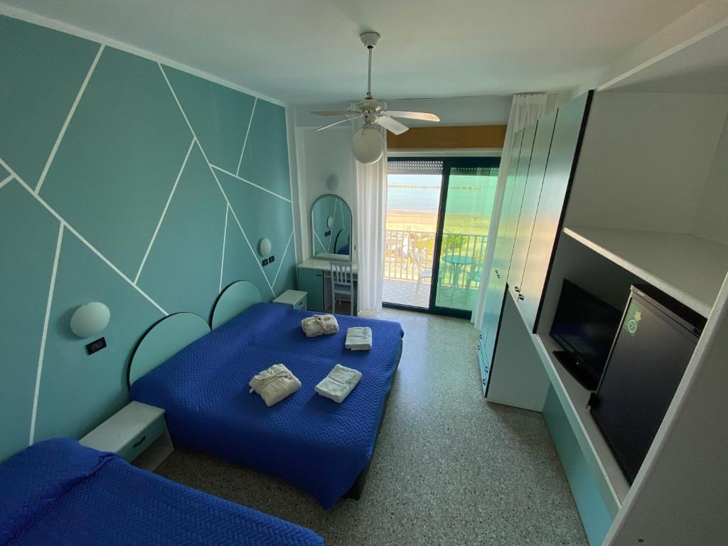 Postel nebo postele na pokoji v ubytování Hotel Royal