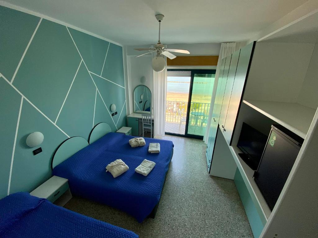 Postel nebo postele na pokoji v ubytování Hotel Royal