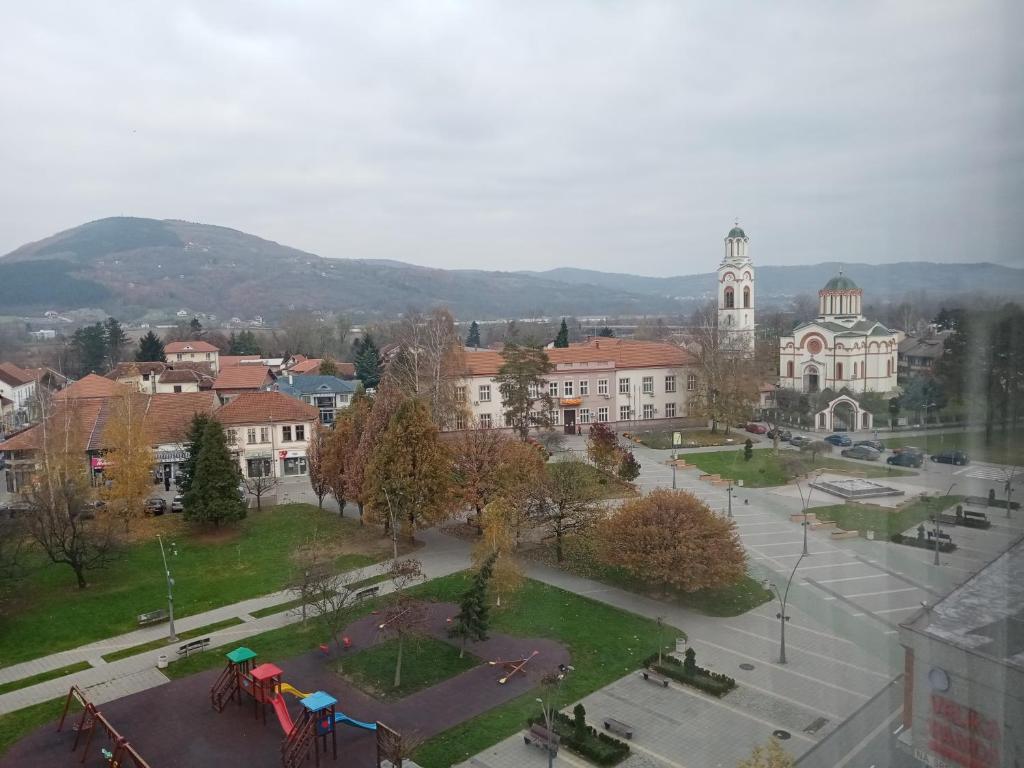 an aerial view of a town with a large building at Apartman Kneginja in Trstenik