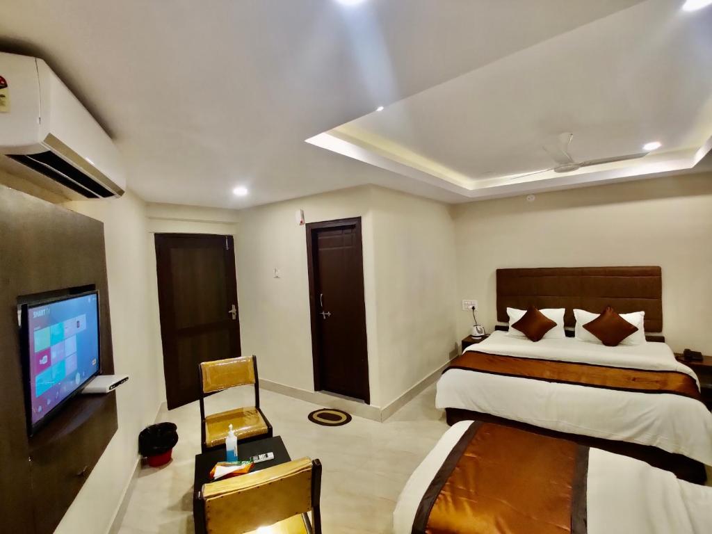 Postel nebo postele na pokoji v ubytování New Hotel Suhail