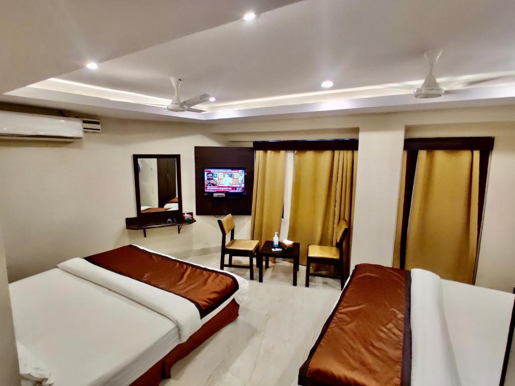 Postel nebo postele na pokoji v ubytování New Hotel Suhail